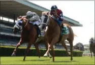  ?? NYRA ?? Kid is Frosty with Irad Ortiz, Jr. aboard on the rail out kick’s longshot Parton Sunday afternoon to win her turf debut in the New York State Stallion Series Cupecoy’s Joy at Belmont Park.