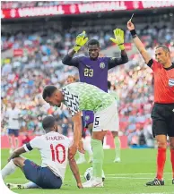  ??  ?? Raheem Sterling is booked by Italian referee Marco Guida for diving