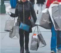  ?? Timothy A. Clary, Afp/getty Images ?? Shoppers take advantage of the Black Friday sales in New York City.