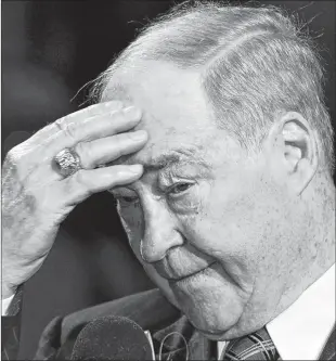  ?? CP PHOTO ?? Toronto Maple Leafs great Leonard (Red) Kelly salutes the cheering crowd as he speaks at his banner raising prior an NHL game between the Ottawa Senators and the Leafs in Toronto on Wednesday Oct. 4, 2006.