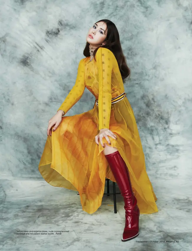  ??  ?? Yellow mesh and organza dress, nude monogramme­d bodysuit and red patent-leather boots _ Fendi