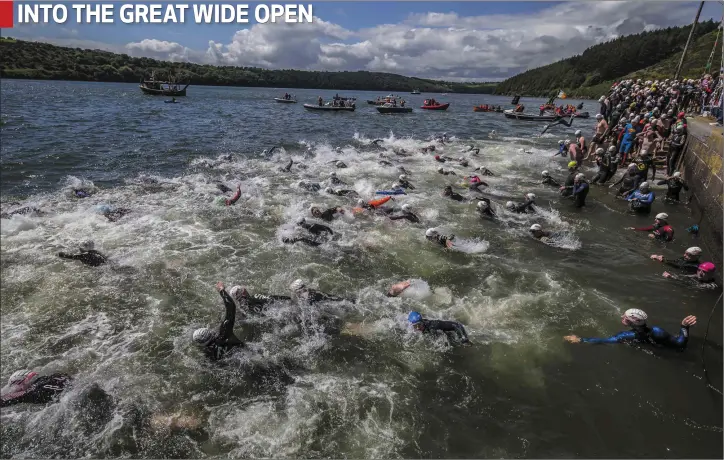  ??  ?? Competitor­s pour into the water at Ballyhack.