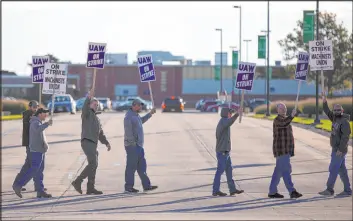  ?? Kelsey Kremer The Associated Press ?? United Auto Workers picket outside of John Deere Des Moines Works on Thursday in Ankeny, Iowa. The Deere workers’ strike began at midnight.