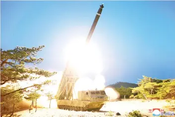  ?? — AFP photo ?? A test-fire of super-large multiple rocket launchers at an undisclose­d location in North Korea.