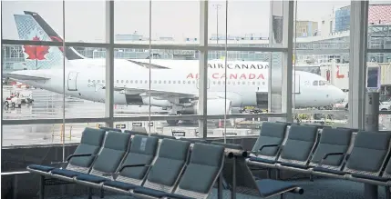  ?? JONATHAN HAYWARD THE CANADIAN PRESS FILE PHOTO ?? Airline passenger numbers are down 94 per cent from 2019, “with aviation still at Stage 0 in its recovery” amid ongoing travel restrictio­ns, the National Airlines Council of Canada said.