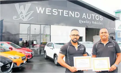  ?? Photo / Dean Taylor ?? Pana (left) and Hamish Bulsara on their award winning yard they opened five years ago, following the success of their online auto business. They say quality is premium — so much so they included it in their business name.