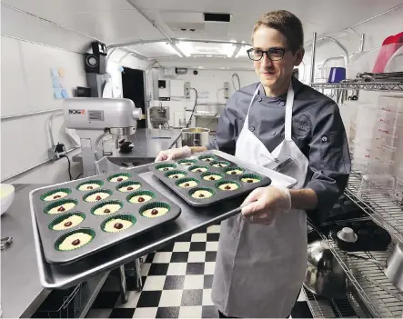  ?? ASSOCIATED PRESS/FILES ?? A tray of cannabis-infused peanut butter and jelly cups is headed for the oven at Sweet Grass Kitchen in Denver. Calgary city officials have been in contact with American states that have already legalized cannabis edibles and seen their popularity increase rapidly.