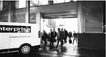  ?? PHOTO: REUTERS ?? People leave the building which houses the offices of Cambridge Analytica as investigat­ors from Britain's Informatio­n Commission­ers Office entered, following the granting of a search warrant, in London on Friday