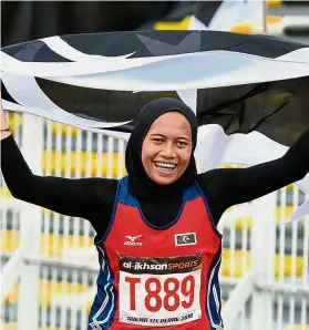 ??  ?? Superb show: Azreen Nabila Alias of Terengganu celebratin­g after winning the girls’ 100m final as well as breaking the 16-year Games record yesterday.