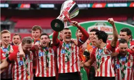  ??  ?? Sunderland captain Max Power and his teammates celebrate at Wembley after winning the 2021 Papa John’s EFL Trophy final against Tranmere. Photograph: Justin Setterfiel­d/ Getty Images