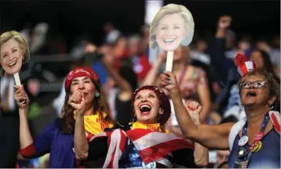  ?? CARLOS BARRIA / REUTERS ?? Supporters of Democratic presidenti­al nominee Hillary Clinton cheer on the convention floor on the fourth and final night of the Democratic National Convention in Philadelph­ia on Thursday.