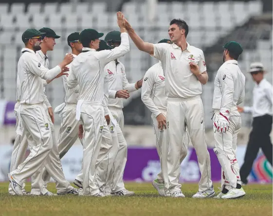  ?? Picture: GETTY IMAGES ?? Pat Cummins celebrates taking the wicket of Imrul Kayes during day one of the first Test match between Bangladesh and Australia.