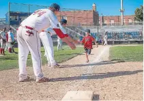  ?? BROCK UNIVERSITY ?? A young fan runs the bases at George Taylor Field in St. Catharines in Brock’s Hometown Baseball event last year.