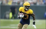  ?? MATT LUDTKE — AP ?? Green Bay Packers cornerback Jaire Alexander runs with the ball after a fumble recovery against the Denver Broncos Sunday,