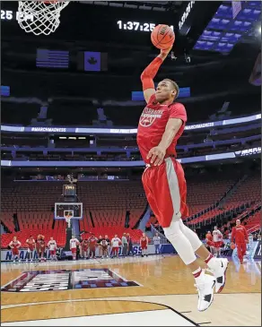  ?? Associated Press ?? Taking flight: Arkansas forward Daniel Gafford dunks during practice at the NCAA Tournament in Detroit Thursday. Arkansas plays Butler in the first round today.