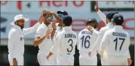  ?? (Pic: BCCI) ?? Teammates celebrate with India spinner Axar Patel (2nd left) after one of his wickets on the fourth day of the second Test against England at the MA Chidambara­m Stadium in Chennai on Tuesday. Patel returned figures of 21-5-60-5 on his Test debut.
