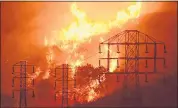  ?? THE ASSOCIATED PRESS ARCHIVES ?? PG&E told analysts that more wildfires are likely due to climate change, and that the state and utility face a “new normal” of destructiv­e infernos.