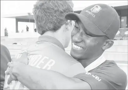  ??  ?? West Indies Under-19s captain Emmanuel Stewart (right) embraces his opposite number Raynard van Tonder following the defeat to South Africa Under-19s.