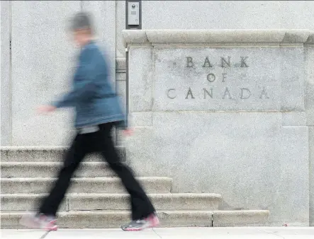  ?? ADRIAN WYLD/THE CANADIAN PRESS FILES ?? Canada’s big banks are warning against overplayin­g concerns about the country’s record debt levels. They say the economy won’t be derailed for numerous reasons, including the view the Bank of Canada won’t hike rates if signs of stress emerge.