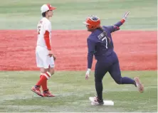  ?? Yuichi Masuda / Getty Images ?? Kelsey Stewart of the U.S. rounds second after her walkoff home run to beat Japan 21 to finish group play in softball.