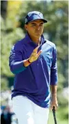  ?? Associated Press ?? n Rickie Fowler waves after putting on the first hole Friday during the second round of the Masters in Augusta, Ga.
