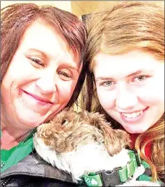  ??  ?? Photo shows Jayme (right), her aunt/godmother Jennifer Naiberg Smith and Molly the dog posing together after being reunited. — AFP photo