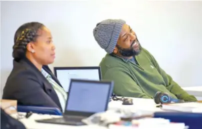  ?? STAFF PHOTO BY OLIVIA ROSS ?? Stacey Bradley and Tai Norman listen as Charolette Brand introduces herself to the EMPACT students Monday at the Youth and Family Developmen­t Center. The nine-week program allows the students to receive Google informatio­n technology certificat­ion.