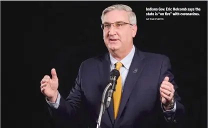  ?? AP FILE PHOTO ?? Indiana Gov. Eric Holcomb says the state is “on fire” with coronaviru­s.