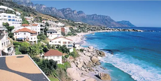  ?? Picture: AFP PHOTO ?? SITTING PRETTY: Growth in the value of properties in suburbs such as Camps Bay in Cape Town continues to outstrip price inflation inland