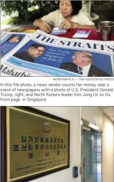  ?? WONG MAYE-E — THE ASSOCIATED PRESS ?? In this file photo, a news vendor counts her money near a stack of newspapers with a photo of U.S. President Donald Trump, right, and North Korea’s leader Kim Jong Un on its front page in Singapore.