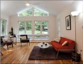  ?? The Washington Post/MARVIN JOSEPH ?? A new sunroom adds square footage and mimics the feel of a back porch by allowing easy views of the rear garden.