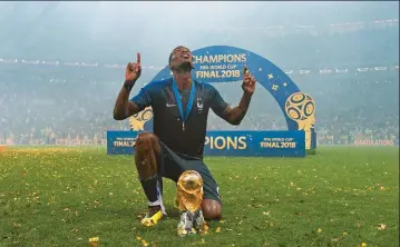  ??  ?? LEFT: French midfielder Paul Pogba poses with the World Cup trophy after his side’s 4-2 victory over Croatia in the 2018 Fifa World Cup final played at Luzhniki Stadium in Russia’s capital, Moscow.