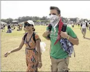  ?? JAY JANNER / AMERICAN-STATESMAN ?? An intrepid concertgoe­r at the 2008 Austin City Limits Festival wears a bandanna to keep out that year’s choking clouds of dust.