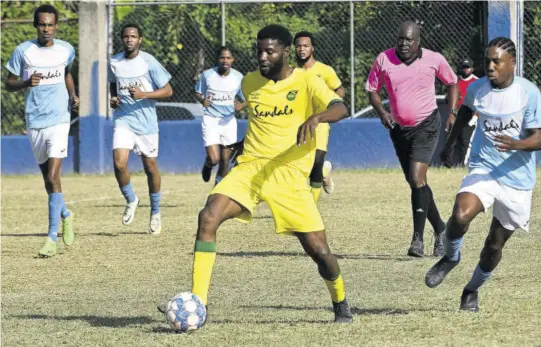  ?? Paul Reid) ?? Flankers FC’S Mosiah Clarke (fourth left) gets away from Granville United’s Amaro Robinson (right) in their first leg semi-final game in the St James FA Sandals Resorts Internatio­nal Major League played at Sam Sharpe Teachers’ College. Flankers FC won the game 2-1.(Photo: