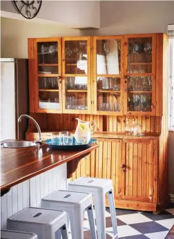  ??  ?? Many of the pieces in the kitchen are heirlooms that Marlene inherited from her grandmothe­r. It was only after they’d started stripping the white paint off the display cabinet (below) that they discovered it was Oregon pine.