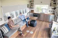  ??  ?? Levy, left, and Chris VanArsdale are two of the owners of Minim Built. They plan to build prefabrica­ted versions of the house.