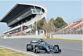  ??  ?? Slow start: Champion Lewis Hamilton surprised on the first day of testing