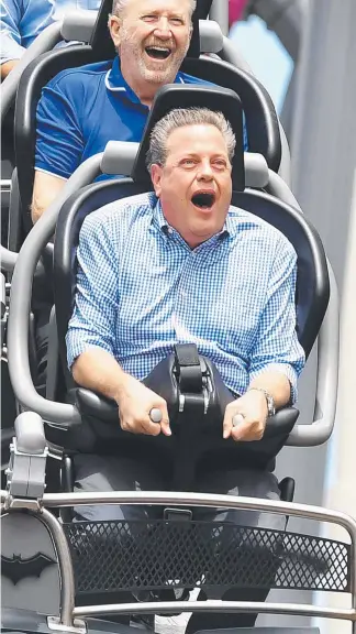  ?? Picture: DAN PELED/AAP ?? Opposition Leader Tim Nicholls takes a ride on the DC Rivals HyperCoast­er at Movie World yesterday, before visiting Currumbin Wildlife Hospital (right).