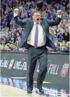  ??  ?? Kansas coach Bill Self celebrates after the Jayhawks beat West Virginia for last season’s Big 12 tournament title. CHARLIE RIEDEL/AP