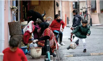  ??  ?? Syrian children play on the streets of Istanbul. Turkey has warned it could allow millions of refugees into Europe. Photograph: Erdem Sahin/EPA