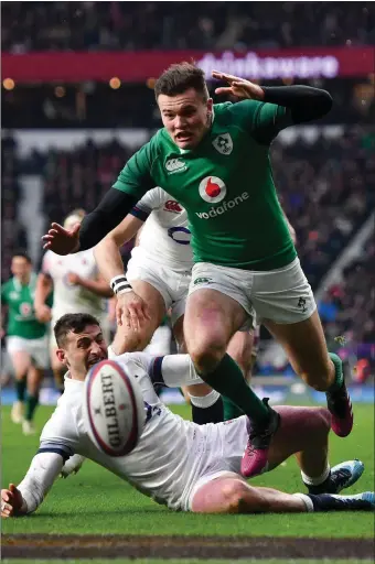  ??  ?? Jacob Stockdale on his way to scoring Ireland’s third try against England.