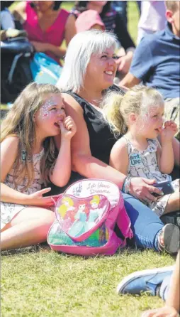  ?? Picture: John Westhrop FM4475501 ?? From left, Beatrice Bull, six, with her mum, Shelly and twoyear-old sister, Tilly, enjoy the fun