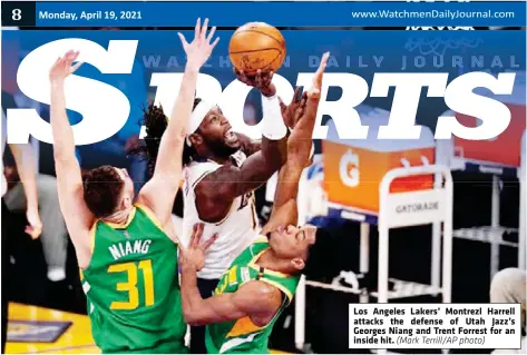  ?? (Mark Terrill/AP photo) ?? Los Angeles Lakers’ Montrezl Harrell attacks the defense of Utah Jazz’s Georges Niang and Trent Forrest for an inside hit.