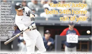  ?? AP
PHOTO ?? ■ New York Yankees right fielder Aaron Judge hits a home run against the Minnesota Twins during the sixth inning of a baseball game on Monday, Sept. 5, 2022 (September 6 in Manila), in New York.