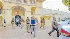 ?? PTI ?? Rajasthan Police officers leave the Central Jail, where a Pakistani prisoner was killed by inmates.