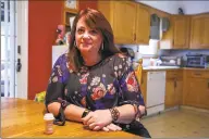  ?? Carl Jordan Castro / Conn. Health I-Team ?? Heather Weise, 50, in her Milford home. While getting ready for work, Weise says she takes morphine to help quell the pain she feels from adhesive arachnoidi­tis.