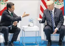  ?? Evan Vucci Associated Press ?? MEXICAN President Enrique Peña Nieto at the G-20 summit with President Trump, who blames NAFTA for the hemorrhagi­ng of U.S. manufactur­ing jobs.