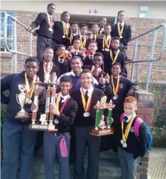  ?? Photo: Supplied ?? The successful Mary Waters U15 side display their trophies and medals at school.