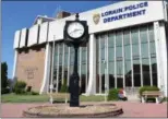  ?? BRIANA CONTRERAS — THE MORNING JOURNAL ?? A street clock in front of Lorain City Hall and the police department on West Erie Avenue is one of four clocks in the downtown and Broadway area that do not fully function or function at all.