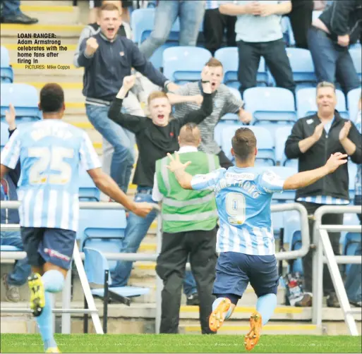  ?? PICTURES: Mike Capps ?? LOAN RANGER: Adam Armstrong celebrates with the home fans after firing in